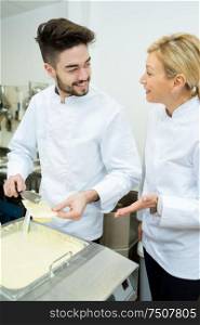 portrait of a cheerful man and woman professional chef