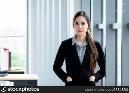 Portrait of a cheerful mature Asian businesswoman at In the office room background,business expressed confidence embolden and successful concept