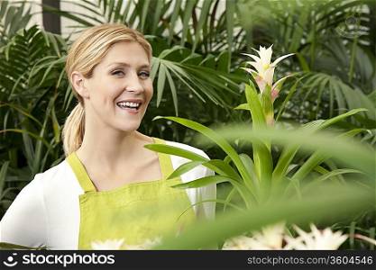 Portrait of a cheerful young woman in garden