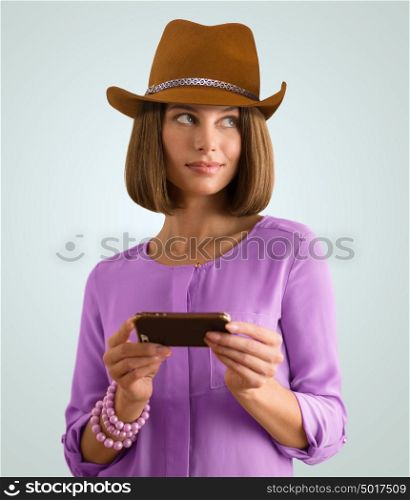 Portrait of a cheerful young woman using her smartphone