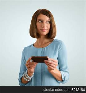 Portrait of a cheerful young woman using her smartphone
