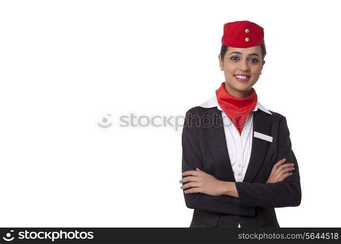 Portrait of a confident air hostess standing against white background