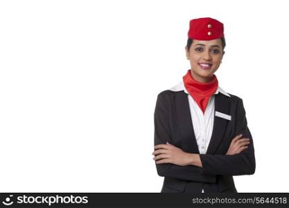 Portrait of a confident air hostess standing against white background