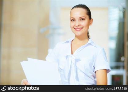 portrait of a confident young businesswoman. Portrait of happy smiling young businesswoman in office