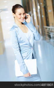 portrait of a confident young businesswoman. Portrait of happy smiling young businesswoman in office