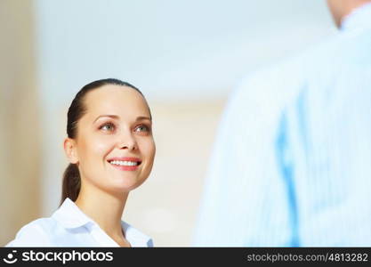 portrait of a confident young businesswoman. Portrait of happy smiling young businesswoman in office