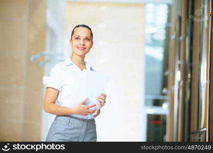 portrait of a confident young businesswoman. Portrait of happy smiling young businesswoman in office