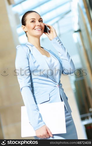 portrait of a confident young businesswoman. Portrait of happy smiling young businesswoman in office