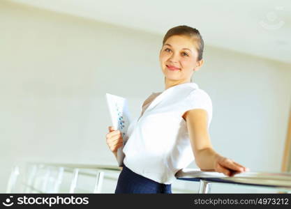 portrait of a confident young businesswoman. Portrait of happy smiling young businesswoman in office