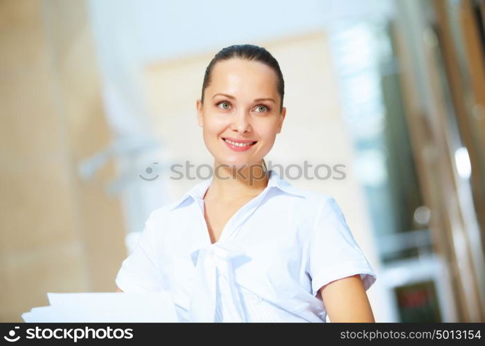 portrait of a confident young businesswoman. Portrait of happy smiling young businesswoman in office