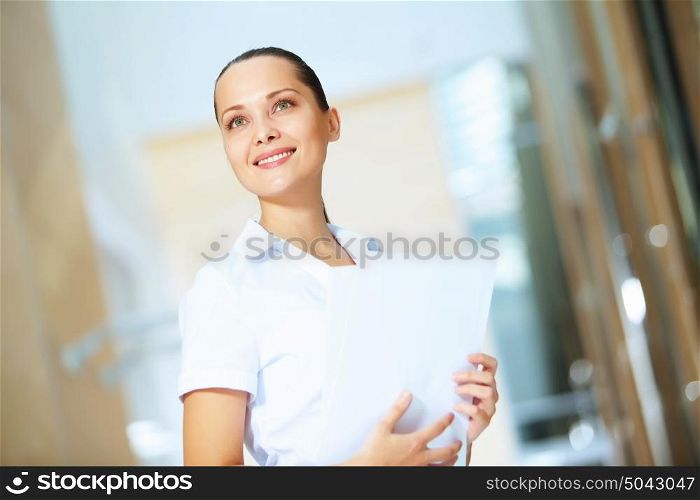 portrait of a confident young businesswoman. Portrait of happy smiling young businesswoman in office