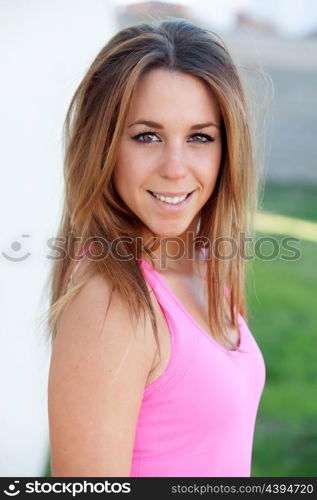 Portrait of a cool pretty woman with pink t-shirt