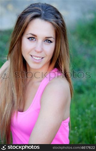 Portrait of a cool pretty woman with pink t-shirt