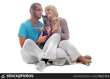 portrait of a couple and two chihuahuas in front of white background