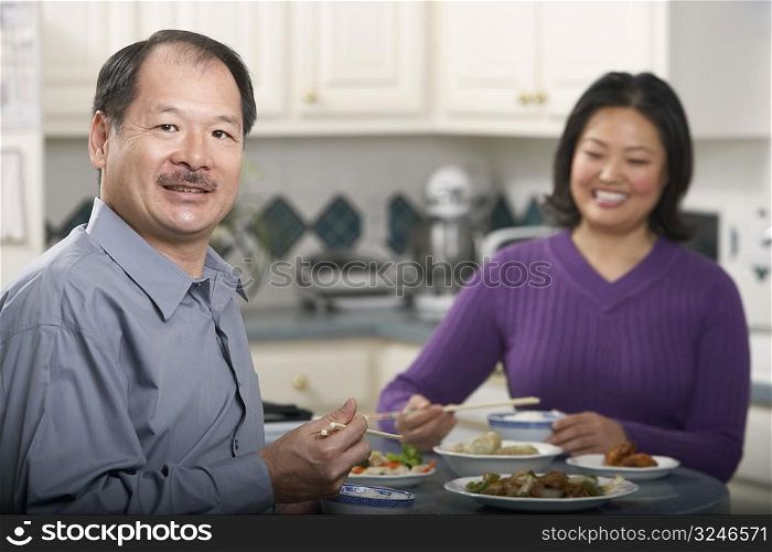 Portrait of a couple eating food