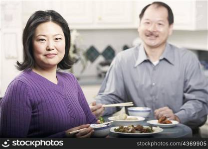 Portrait of a couple eating food