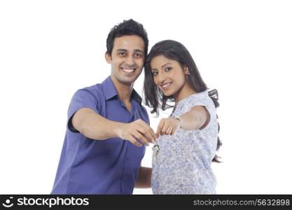 Portrait of a couple holding house keys
