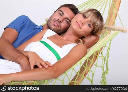 portrait of a couple in a hammock