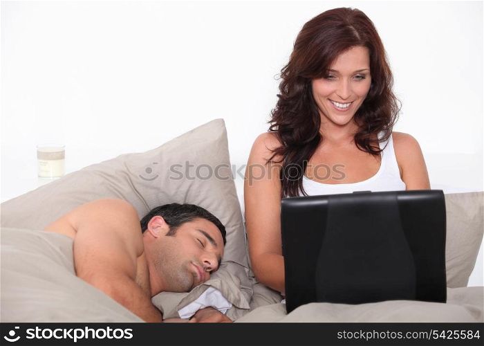 portrait of a couple in bed