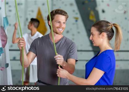 portrait of a couple in climbing center