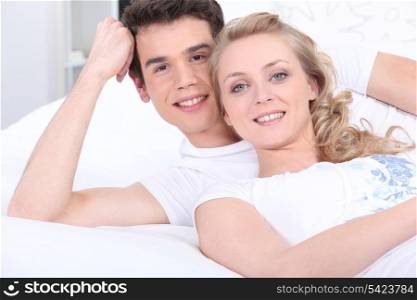 Portrait of a couple lying down