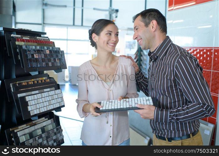 portrait of a couple purchasing mosaic tiles