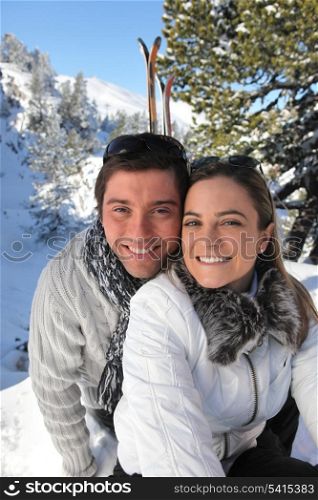 Portrait of a couple skiing in the Alps