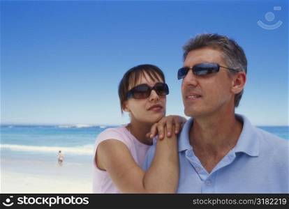 Portrait of a couple standing on the beach
