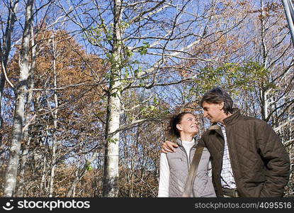 Portrait of a couple surrounded by trees
