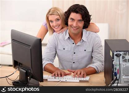 portrait of a couple with computer