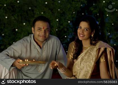 Portrait of a couple with diyas
