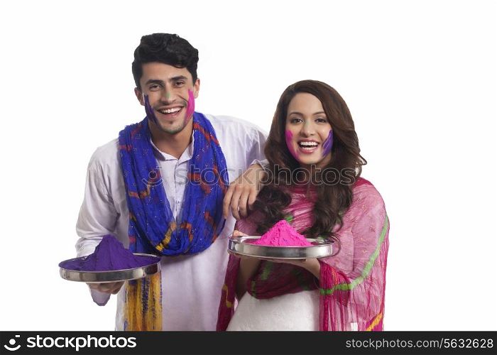 Portrait of a couple with holi colours