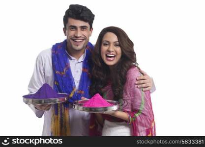 Portrait of a couple with holi colours