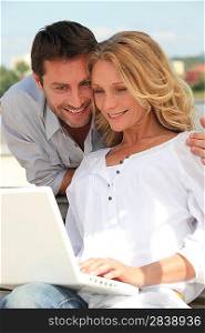portrait of a couple with laptop