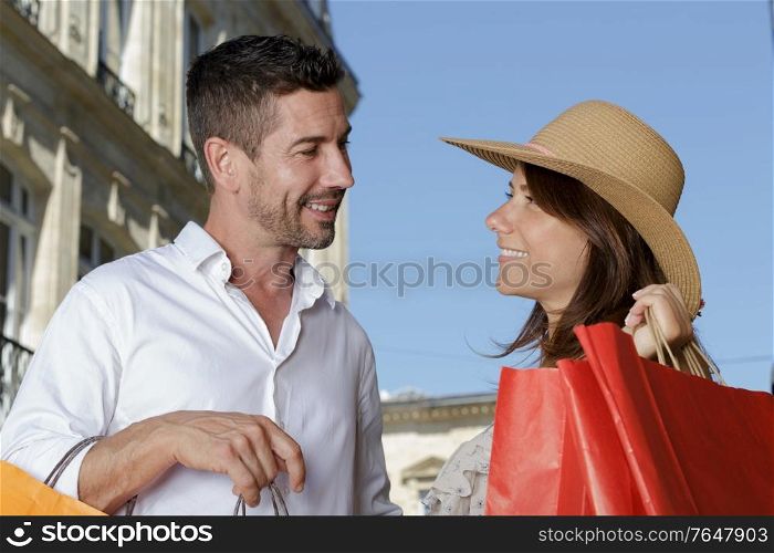 portrait of a couple with shopping bags