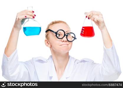 Portrait of a crazy lab assistant with two colored substance bulbs on a white background