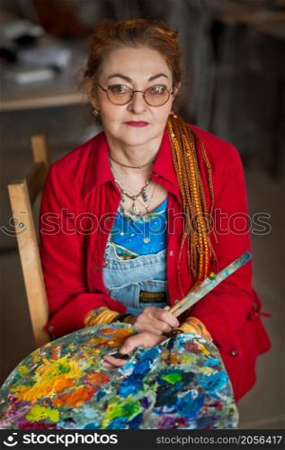 Portrait of a creative person in a working environment.. A woman artist in a creative setting 2934.