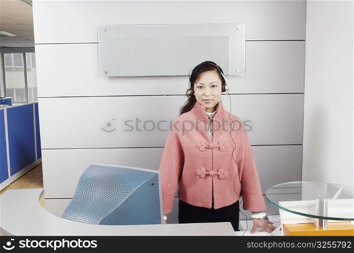 Portrait of a customer service representative standing in an office