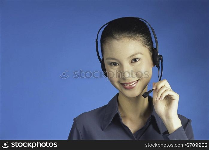 Portrait of a customer service representative wearing a headset smiling