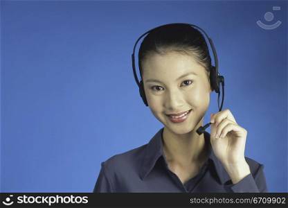 Portrait of a customer service representative wearing a headset smiling