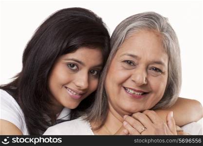 Portrait of a cute girl and her grandmother smiling