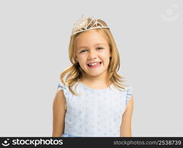 Portrait of a cute happy little girl wearing a princess crown