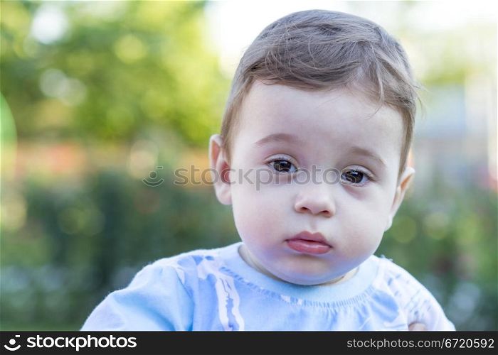 Portrait of a cute little baby boy with innocent eyes.