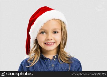 Portrait of a cute little girl weriing a santa hat