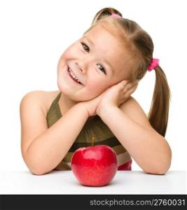 Portrait of a cute little girl with red apple, isolated over white