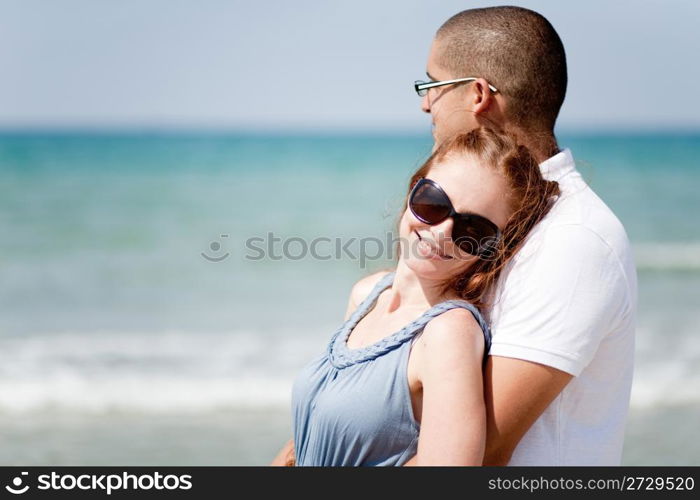 Portrait of a cute romantic couple at beach