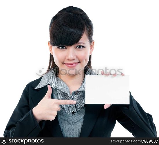 Portrait of a cute young Asian businesswoman pointing at blank card, isolated on white background.