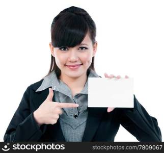 Portrait of a cute young Asian businesswoman pointing at blank card, isolated on white background.