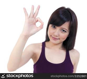 Portrait of a cute young female showing OK sign, isolated on white background