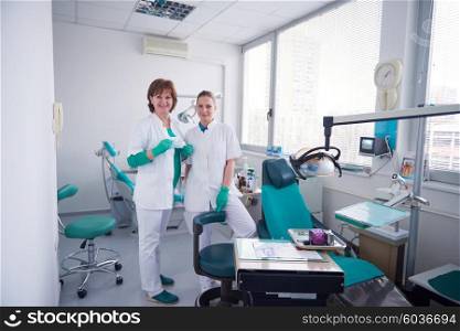portrait of a dentist smiling at the camera